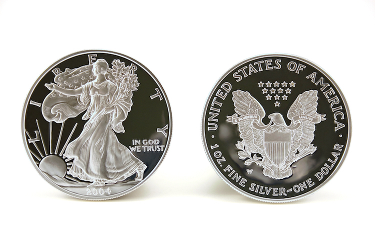 Two American Eagle Silver Bullion Coins (legal tender) showing the front and back of the coin