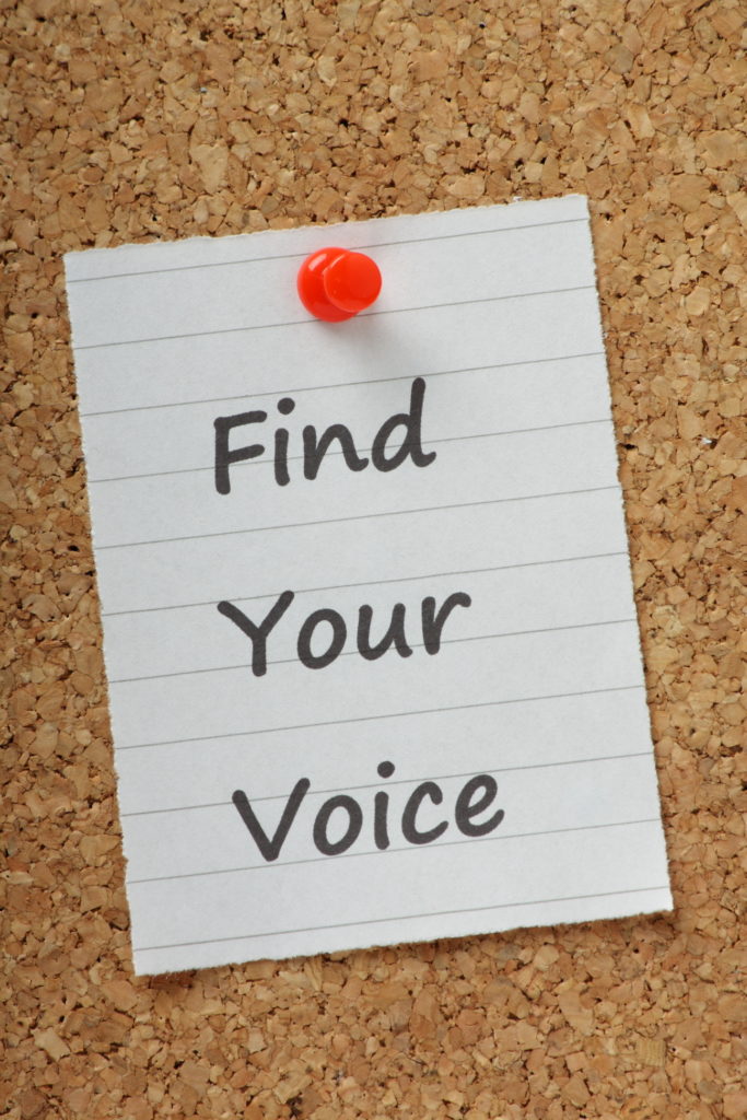 Note with Find Your Voice on cork board